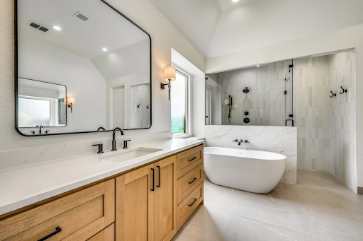Luxury bathroom remodel in Temecula featuring a custom wood vanity, quartz countertop, freestanding soaking tub, spacious walk-in shower, modern fixtures, and elegant finishes designed to increase home value and provide a high return on investment.